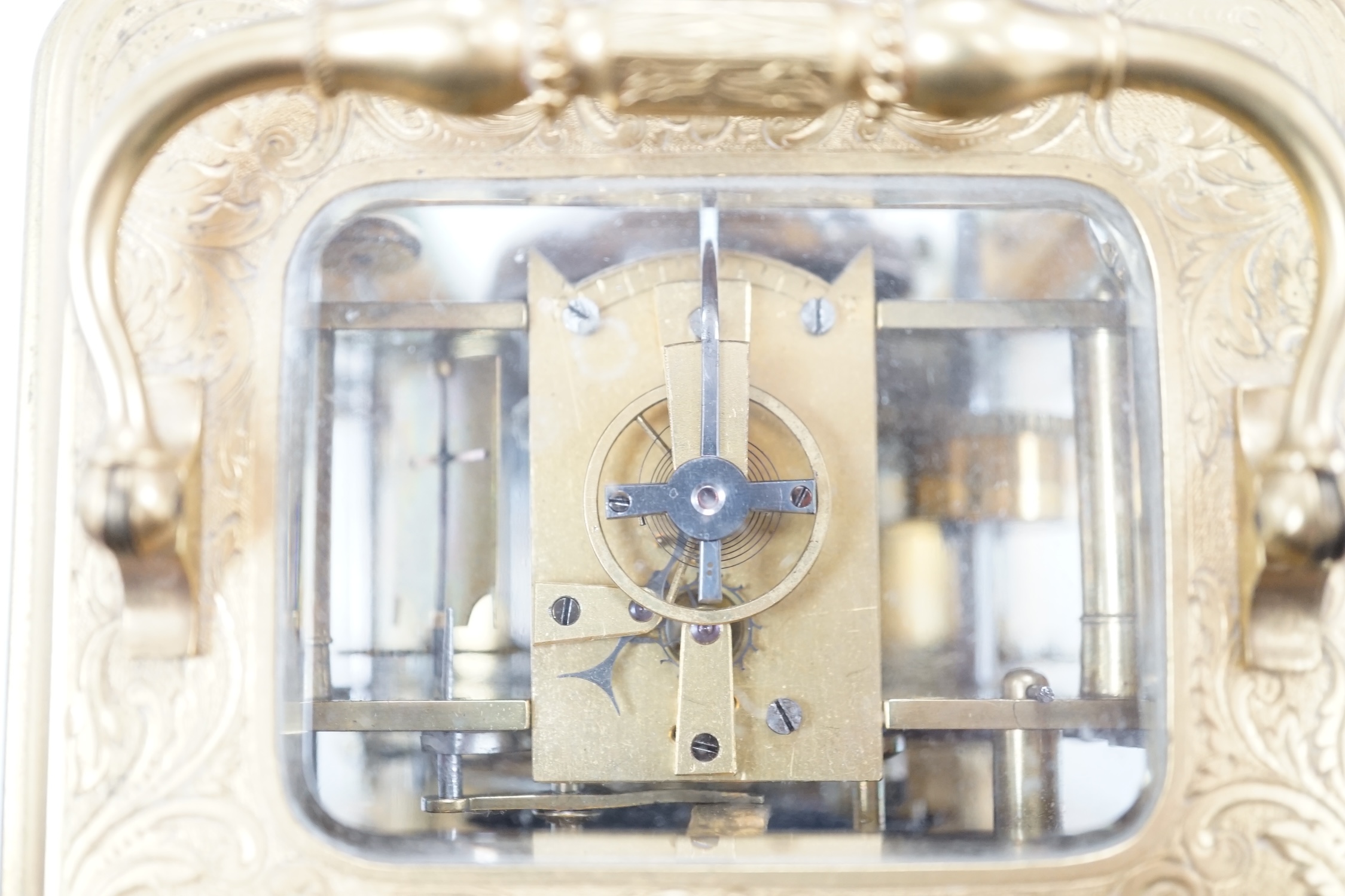 A late 19th century engraved brass cased repeating alarm carriage clock, dial signed Demeur, Her du Roi, Bruxelles, height 13cm.